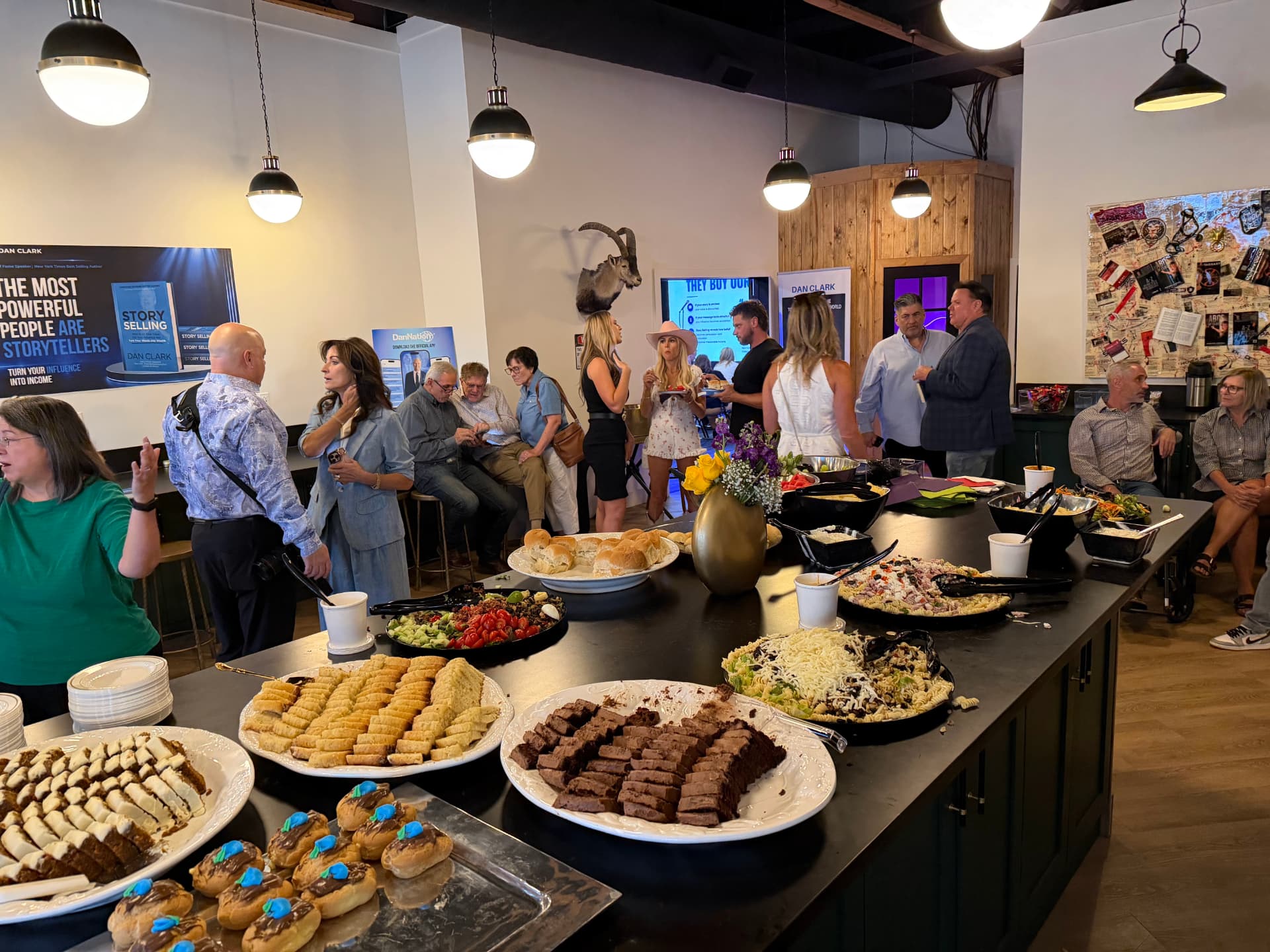 HIVE event space lit with warm amber lighting during a party